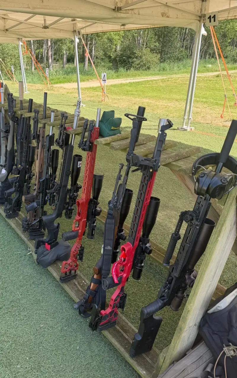 A row of precision rifles in the rack at the firing line